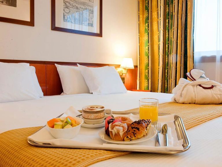 Breakfast in a deluxe room at Hotel Catullo